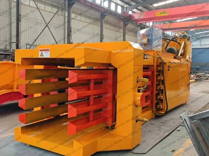 Horizontal paper baler machine